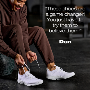 the shoes are a game changer. you just have to try them to believe them. quote from don. model sitting in gym wearing oomg sport ls white